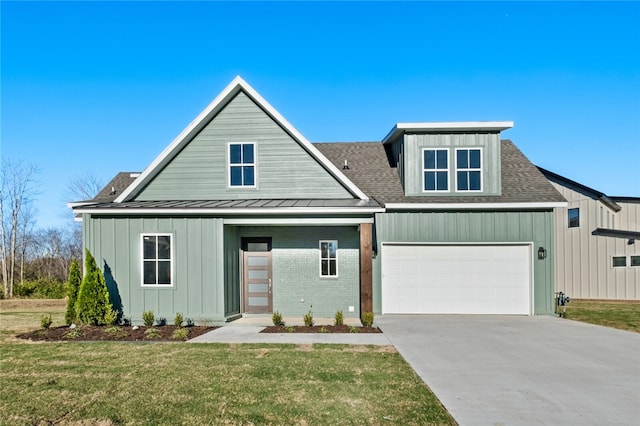 view of front facade with a garage and a front lawn