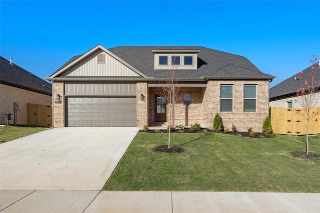 view of front of home featuring a front yard and a garage