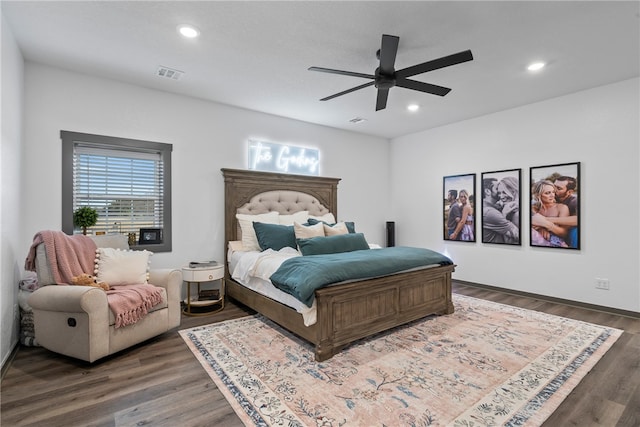 bedroom featuring ceiling fan and dark hardwood / wood-style floors