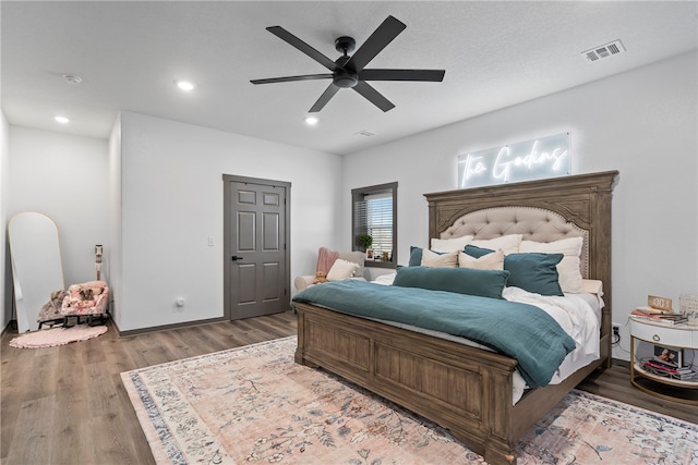 bedroom featuring ceiling fan and hardwood / wood-style floors