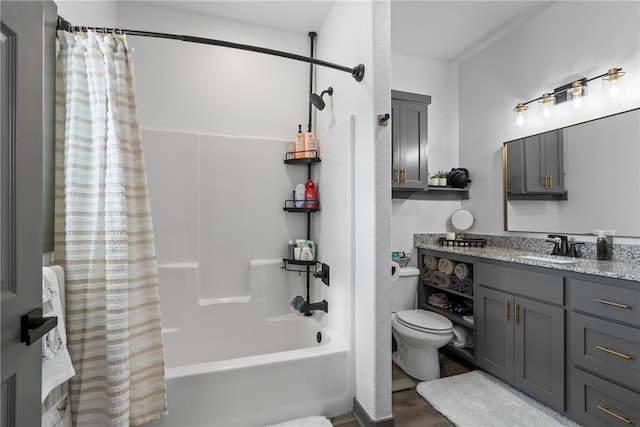 full bathroom featuring toilet, hardwood / wood-style floors, vanity, and shower / tub combo with curtain