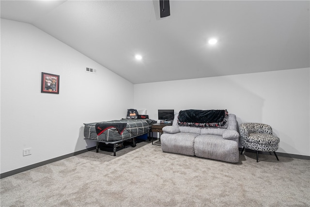 interior space featuring carpet floors and vaulted ceiling