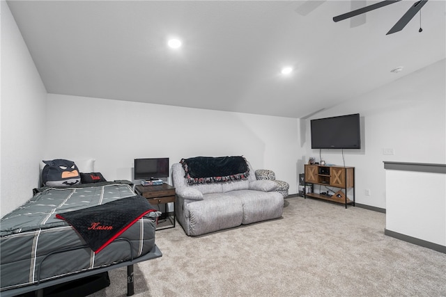 living room with ceiling fan, light colored carpet, and lofted ceiling