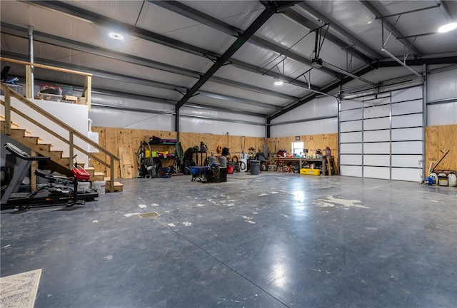 garage featuring wooden walls