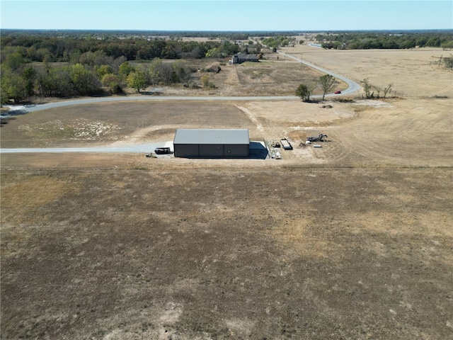 birds eye view of property with a rural view