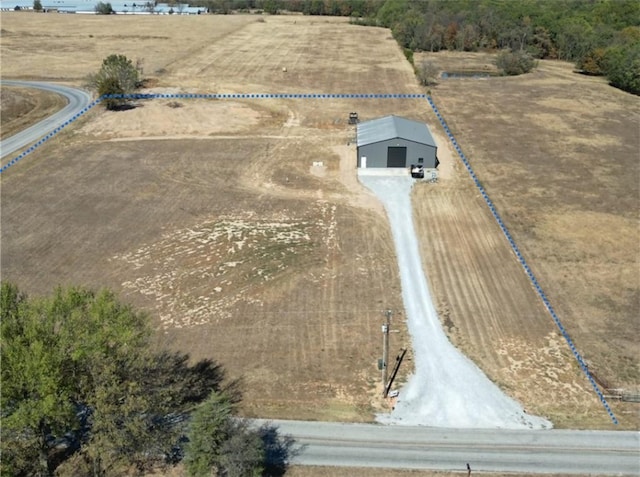 birds eye view of property with a rural view