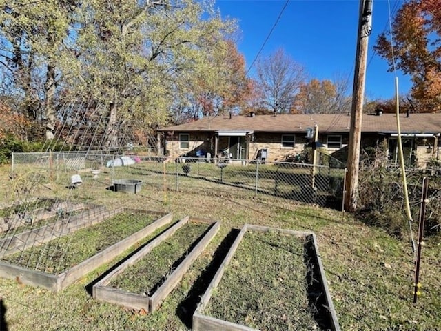 659 Genevieve Ave, Fayetteville, AR 72704 - view of yard with a vegetable garden