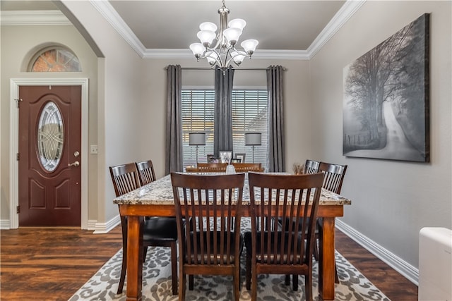 dining room with an inviting chandelier, dark wood-type flooring, and crown molding