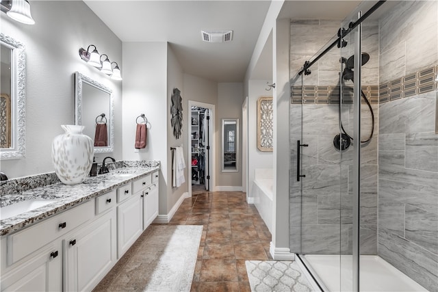 bathroom with vanity, tile patterned floors, and independent shower and bath