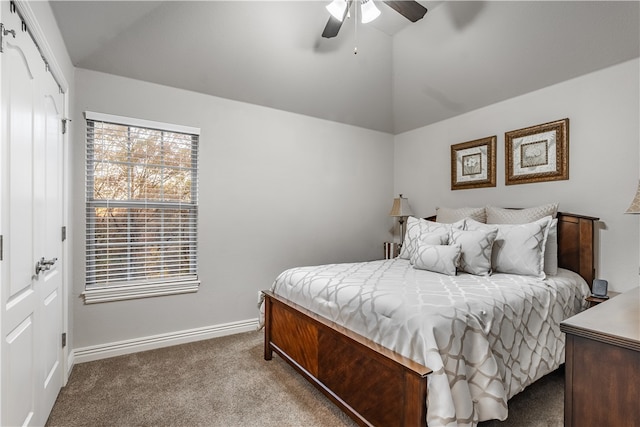 carpeted bedroom with a closet, ceiling fan, and lofted ceiling