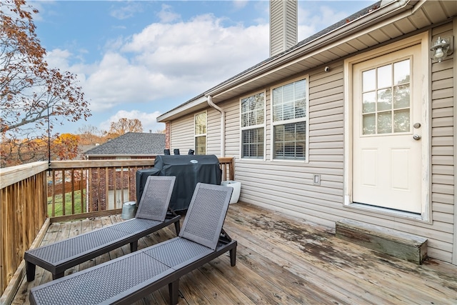 wooden terrace with grilling area