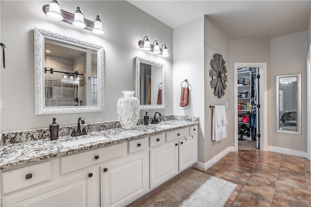 bathroom with tile patterned flooring and vanity