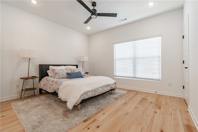 bedroom featuring hardwood / wood-style flooring and ceiling fan