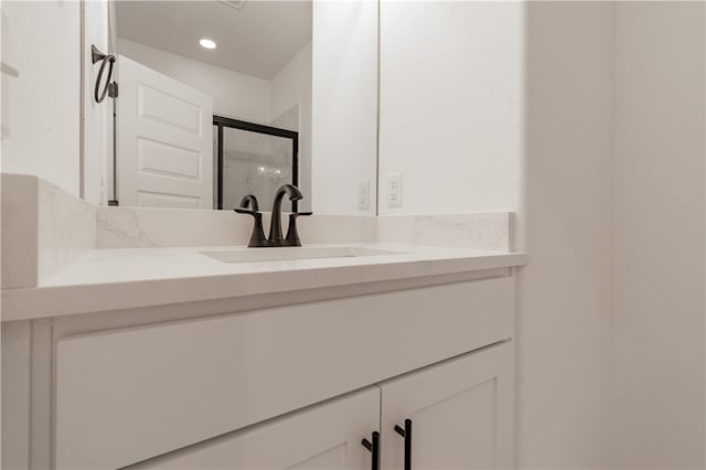 bathroom with vanity and walk in shower