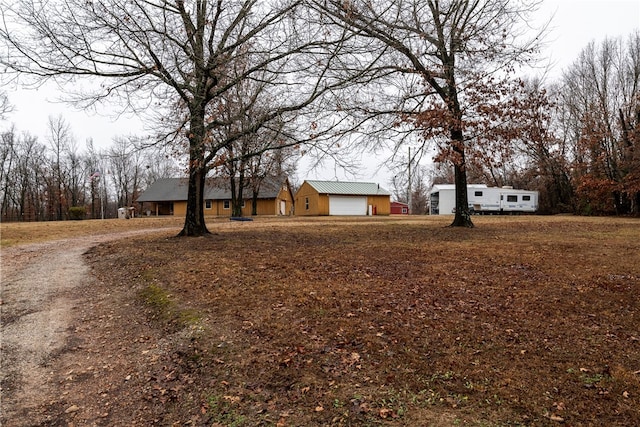 view of yard featuring a garage