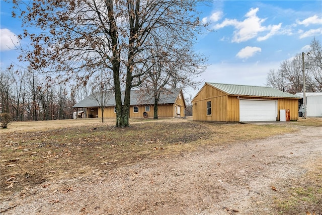 view of front of property with an outbuilding and a garage