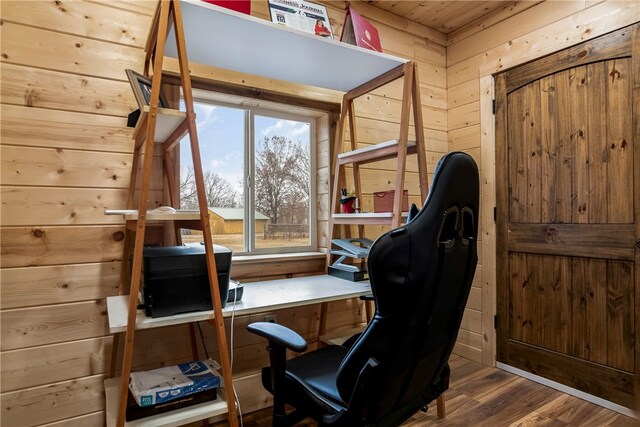 home office featuring wooden walls and hardwood / wood-style floors