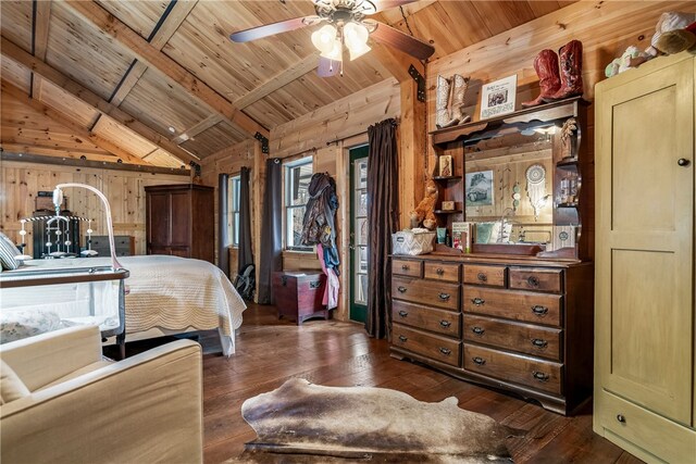 bedroom with wood walls, wooden ceiling, ceiling fan, dark hardwood / wood-style flooring, and vaulted ceiling with beams