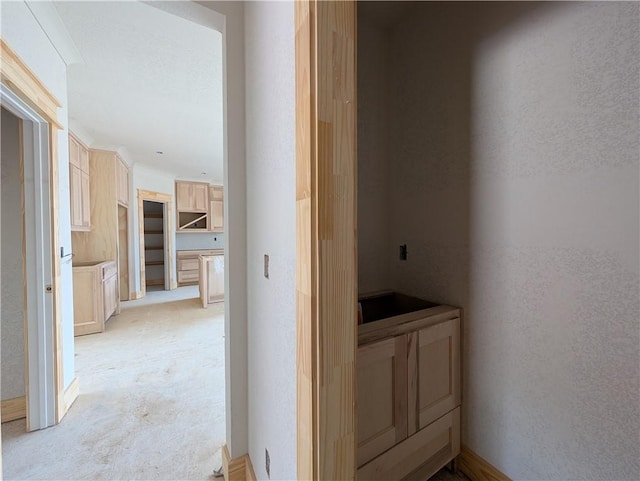 hallway featuring a textured wall