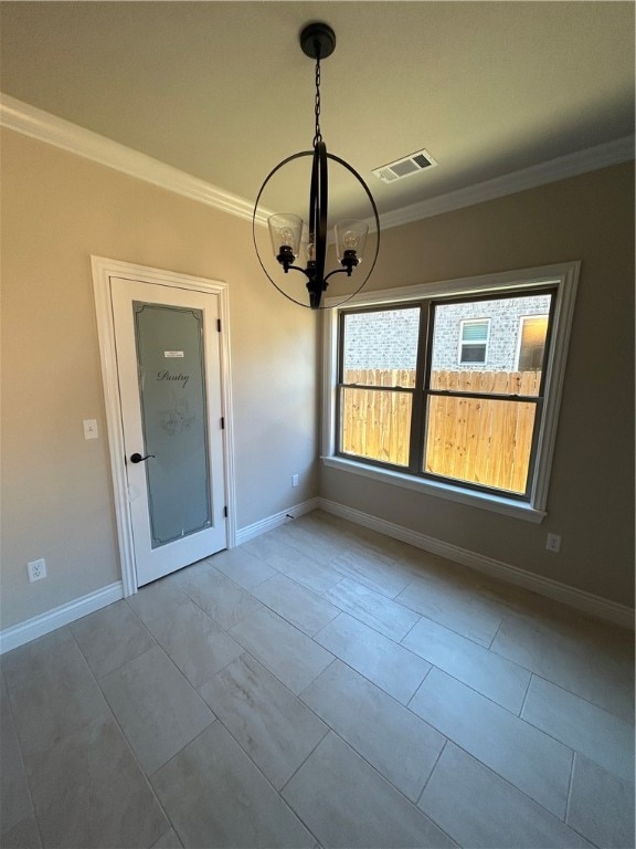 unfurnished dining area featuring tile patterned floors, ornamental molding, and an inviting chandelier