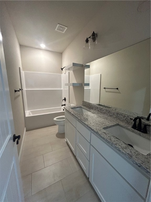 full bathroom with tile patterned floors, vanity, shower / bath combination, and toilet