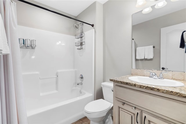 full bathroom featuring shower / bathtub combination with curtain, vanity, and toilet