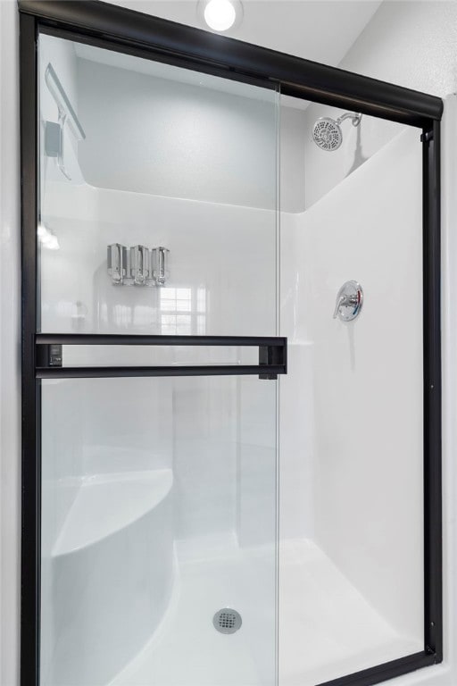 bathroom featuring an enclosed shower