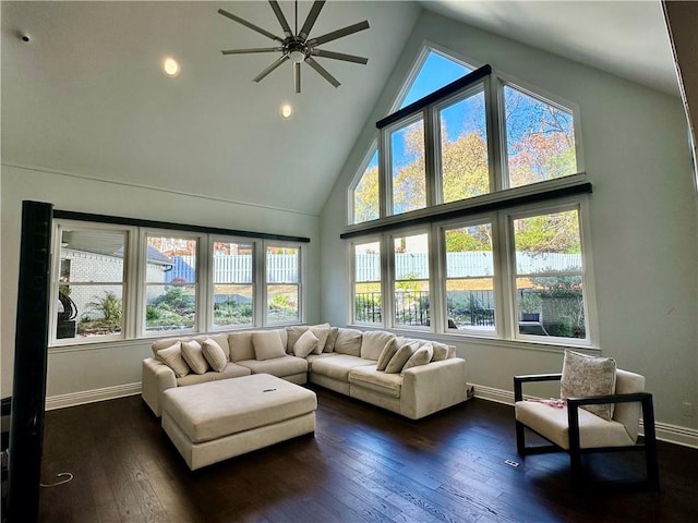 sunroom featuring a wealth of natural light, lofted ceiling, and ceiling fan