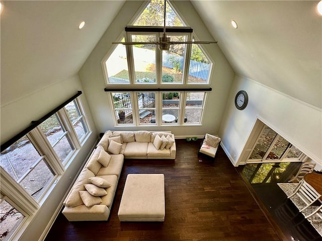 living room featuring ceiling fan, dark hardwood / wood-style flooring, and high vaulted ceiling