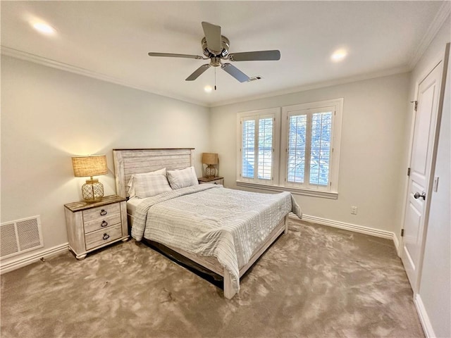 carpeted bedroom with ceiling fan and crown molding