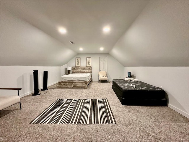 carpeted bedroom with vaulted ceiling