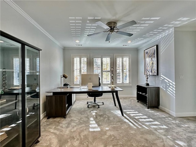 home office featuring light carpet, ceiling fan, and ornamental molding