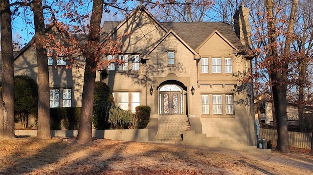 english style home with french doors