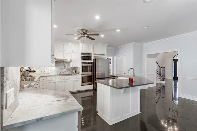 kitchen with stainless steel appliances, light stone countertops, ornamental molding, and a sink