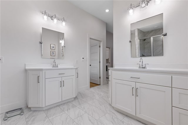 bathroom featuring vanity and an enclosed shower