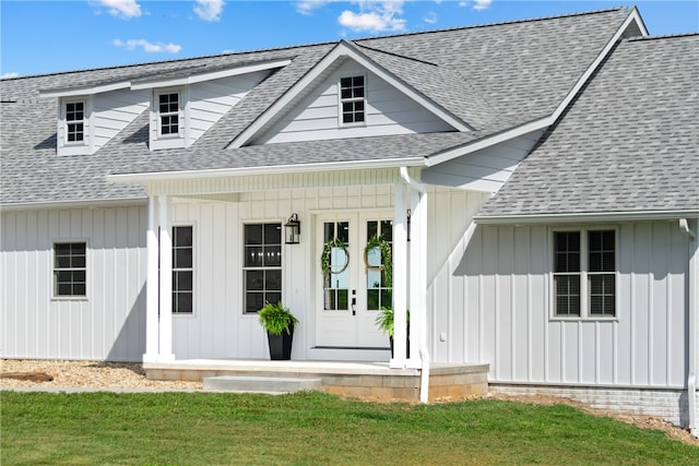 view of front of house featuring french doors and a front lawn