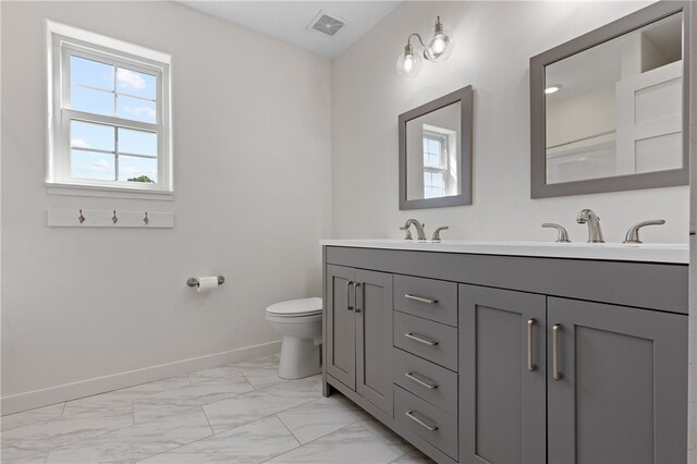 bathroom with vanity and toilet