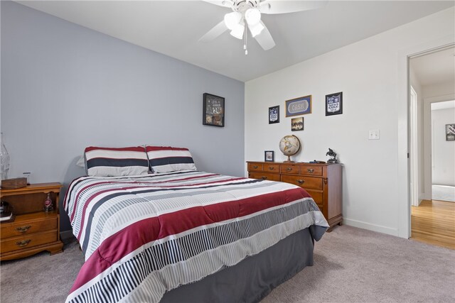 carpeted bedroom with ceiling fan