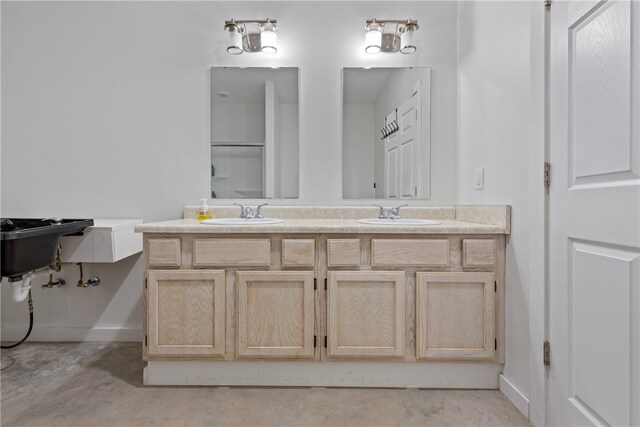 bathroom featuring concrete flooring, a shower, and vanity