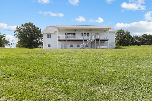 rear view of house with a lawn