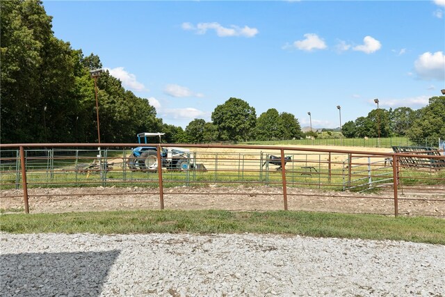 view of jungle gym with a rural view