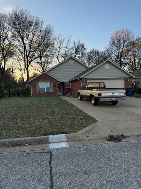 view of front facade featuring a yard and a garage