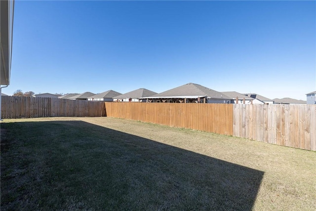 view of yard featuring a fenced backyard