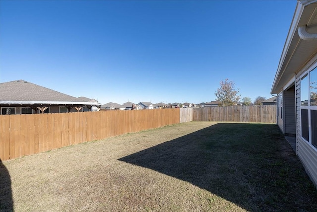 view of yard featuring a fenced backyard