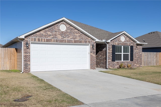 ranch-style home with brick siding, fence, a front yard, driveway, and an attached garage