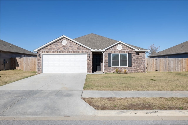 view of front of home with brick siding, fence, concrete driveway, a front yard, and a garage