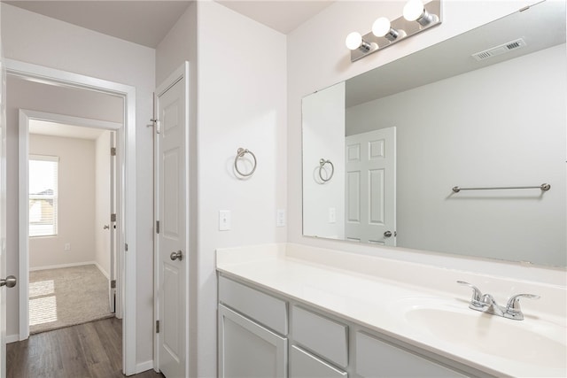 bathroom featuring vanity and wood-type flooring