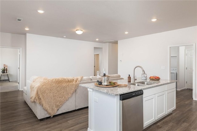 kitchen with a kitchen island with sink, a sink, white cabinets, stainless steel dishwasher, and open floor plan