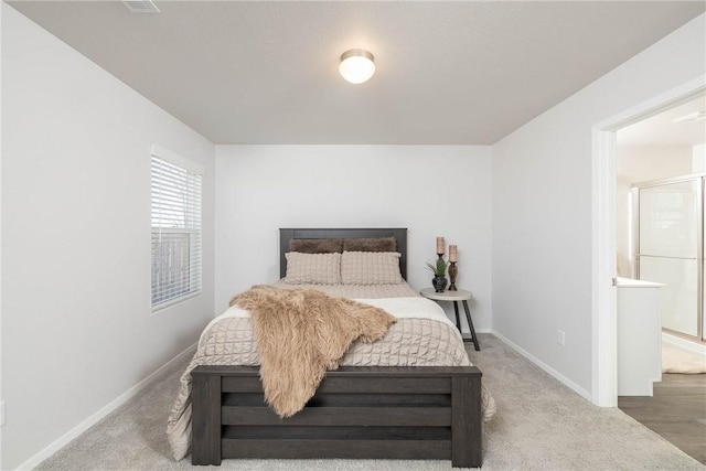 carpeted bedroom with baseboards