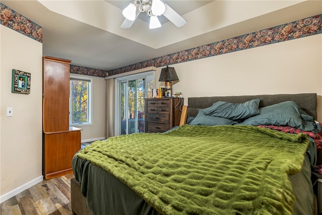 bedroom with ceiling fan and wood-type flooring